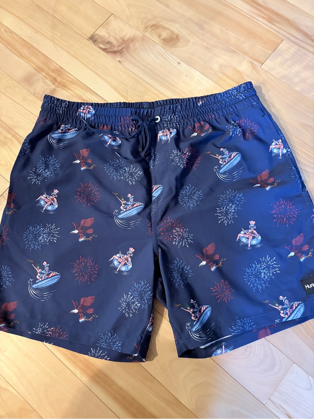 NWOT Navy Patriotic Swim Trunks with Firework Print. NEVER WORN